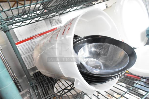 Three-tier shelf with coffee pots, clear poly cylindrical bins, and black poly drop-in bin lids. Good condition.