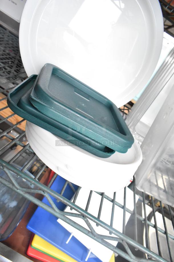 Three-tier lot with coffee pots, poly drop-in bin lids, and cylindrical bins on a metal shelf.