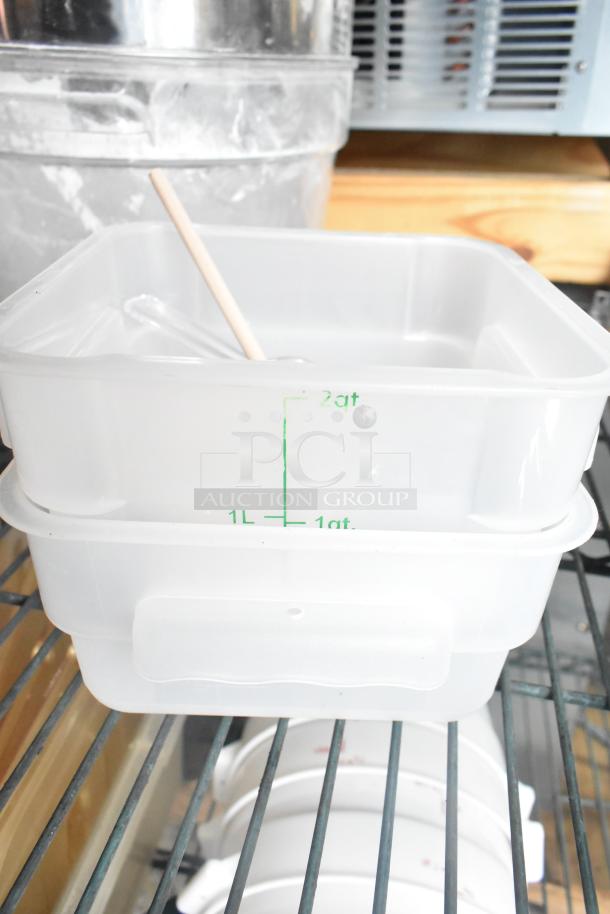 Three tier lot with coffee pots, poly drop-in bin lids, and poly cylindrical bins. Bins show volume markings.