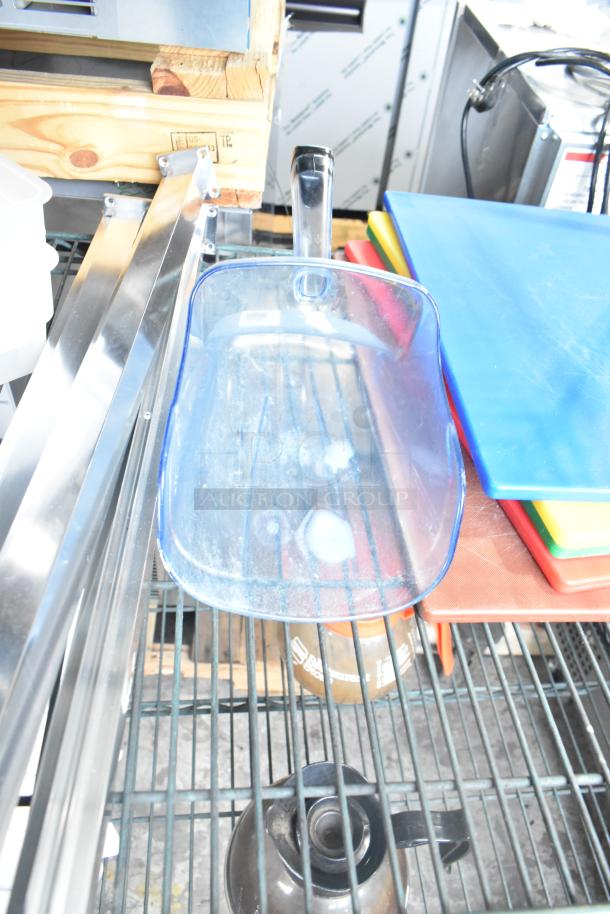 Three-tier lot including coffee pots, poly drop-in bin lids, colorful cutting boards, and poly cylindrical bins, all on metal shelving.