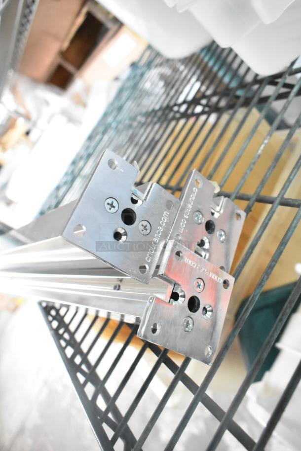 Three-tier lot with metal railings and visible "crucial.com" marking. Includes coffee pots, poly bin lids, and bins.