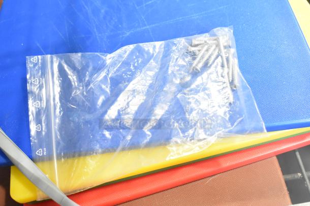 Three-tier lot includes coffee pots, poly drop-in bin lids, poly cylindrical bins. Bag with screws on colorful cutting boards.