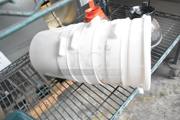 Three tier lot with coffee pots, poly drop-in bin lids, and cylindrical bins on metal shelving. Mixed condition.