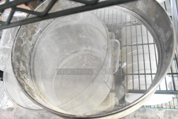 Three-tier lot with coffee pots, poly drop-in bin lids, and poly cylindrical bins on metal shelving. Mixed condition.