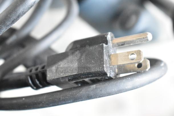 Close-up of a power plug with a black cord, part of the AvaMix 928IBHD18 18" Heavy-Duty Variable Speed Immersion Blender.