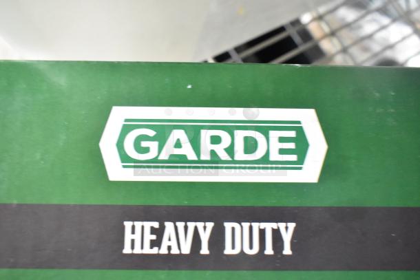 Garde Heavy Duty commercial can opener box, brand new condition, featuring models 181COM2NB and 181COM1BSTMA.