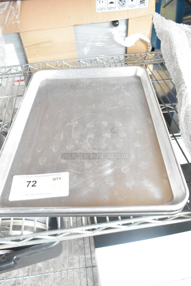 Three metal half-size baking pans with visible light wear, each tagged with "72, QTY x3" from PCIAuctions.com.
