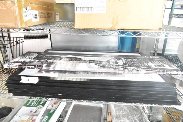 Nine-piece auction lot including a cutting board rack and framed pictures on a metal shelf. Visible label: "Vote."