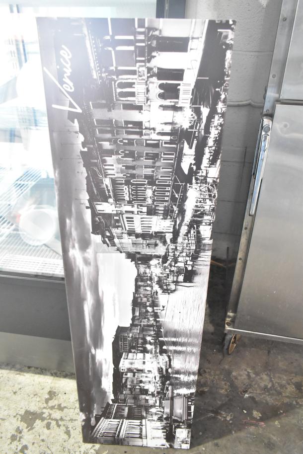 Black and white photo of Venice, showing a canal and buildings, part of a mixed auction lot including a cutting board rack.