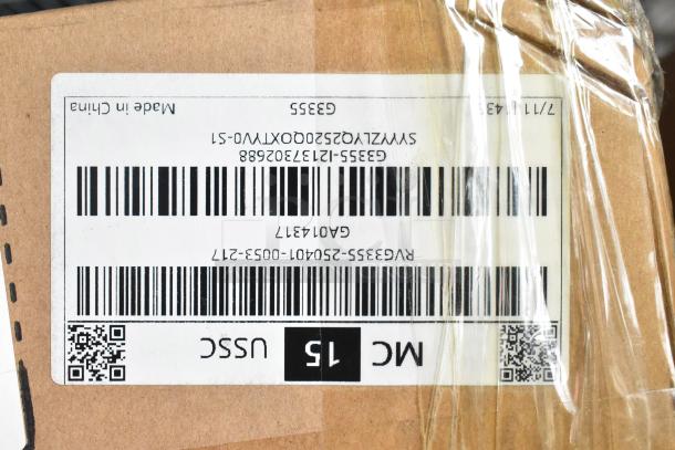 Box of 2 brand new scratch and dent grease hood filters, labeled as made in China with visible barcodes and product codes.