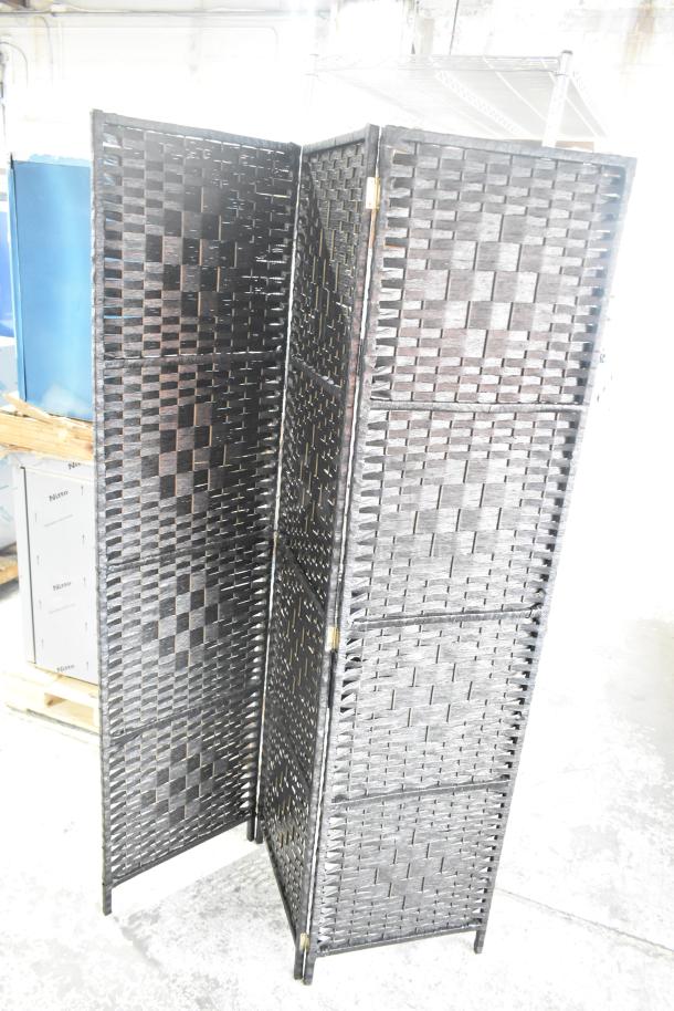 Trifold wicker style room divider, dark finish, three-panel design, sturdy frame. Ideal for privacy or decor enhancement.