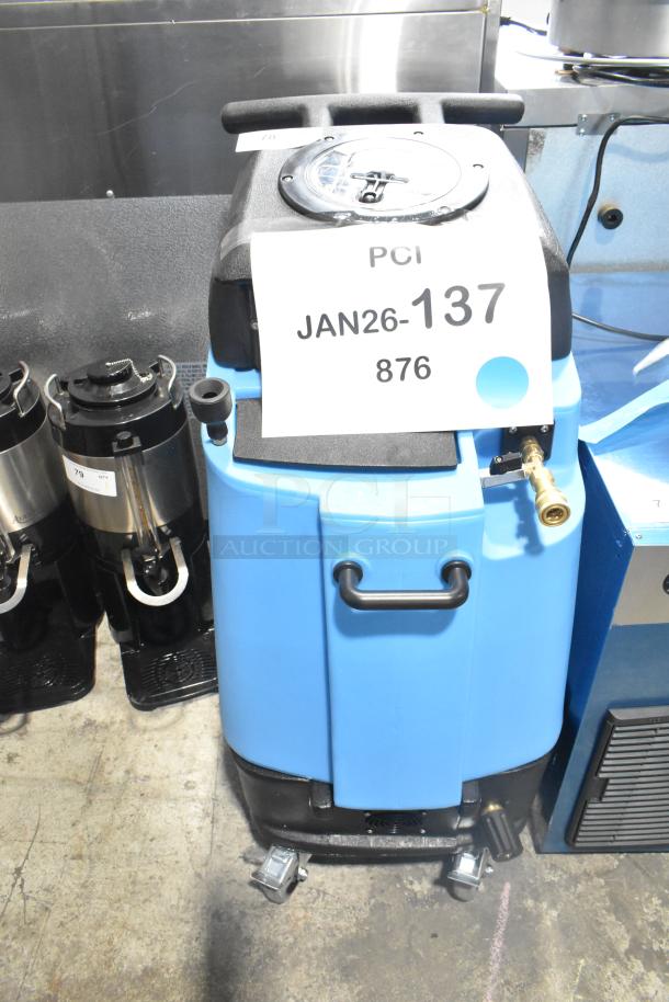 Brand new Mytee 1003DX-230 Speedster heated carpet extractor, 10-gallon, 230V, blue, scratch and dent condition, auction tag visible.