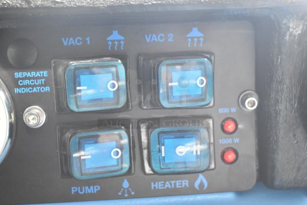Close-up of Mytee 1003DX-230 Speedster controls, featuring VAC and heater switches, wattage indicators, and circuit markings.