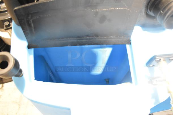 Brand new Mytee 1003DX-230 Speedster carpet extractor, 10-gallon, 230V, scratch and dent condition, blue interior view.