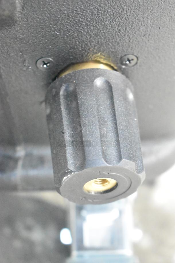Close-up of Mytee 1003DX-230 Speedster Carpet Extractor component, showing textured black knob on sturdy housing.