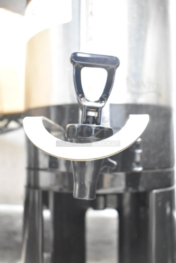 Avantco 1.5 Gallon Thermal Coffee Server, Model 177CS15, with stand. Features chrome spout, sturdy handle. Good condition.