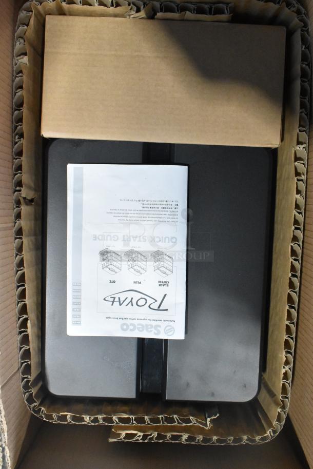 Brand new Saeco OCS New Royal OTC Espresso Machine in box. Includes quick start guide. Notable scratch and dent.