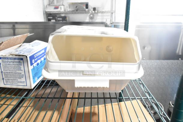 Two-tier lot with poly drop-in bins and ingredients bin on metal shelf. Includes Steramine sanitizer boxes. Items appear unused.