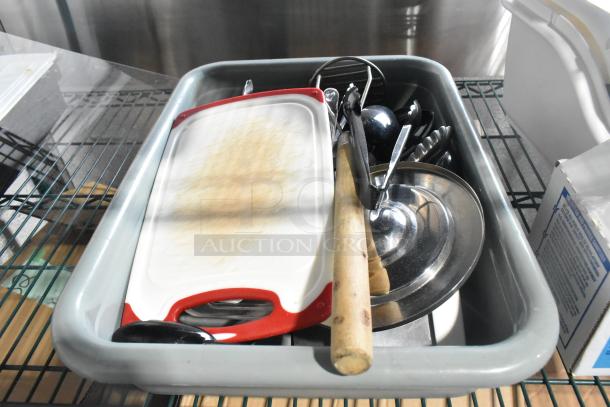 Two-tier lot with poly drop-in bins, various utensils, and an ingredient bin. Includes cutting board and metal dishes.