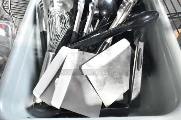Two-tier lot with poly drop-in bins and various utensils, including spatulas, tongs, and whisks, in used condition.