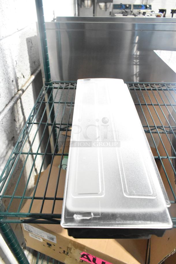 Two-tiered lot with poly drop-in bins, utensils, and ingredient bin on a metal shelf. Includes "ALL ONE MONEY!" label.