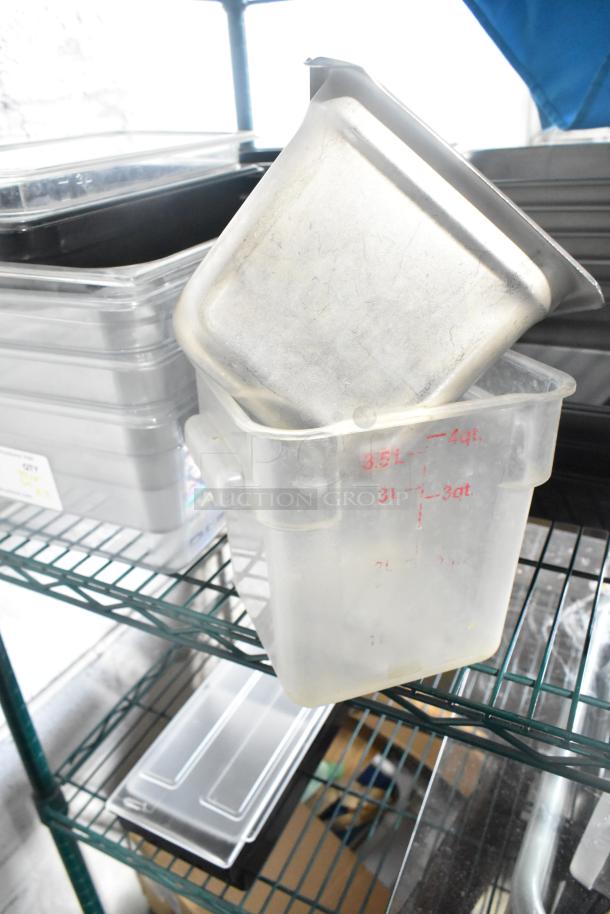 Two-tier lot with poly drop-in bins, utensils, and ingredient bin on metal rack. Clear measurements visible. Good condition.