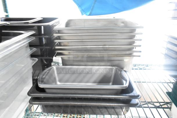 Two-tier lot of poly drop-in bins, utensils, ingredient bin, stainless steel trays, and black storage containers.