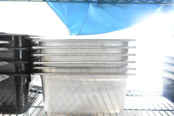 Two-tier lot featuring stacked poly drop-in bins on a wire shelf with visible metal edges.