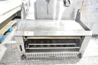 Vulcan Commercial Gas Cheese Melter with adjustable shelves, stainless steel body, used condition, item label "86."