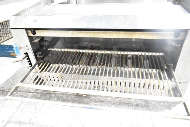 Vulcan Commercial Gas Cheese Melter, stainless steel, used condition, visible grill rack, serial markings present.