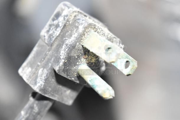 Power plug of a Randell Commercial 2 Drawer Cooler, showing wear. 115 volts, 1 phase. Plug appears dusty and worn.