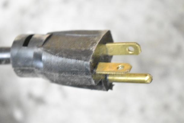 Alt text: Close-up of a power plug for the Structural Concepts Oasis CO47R merchandiser, 220 volts, 1 phase.