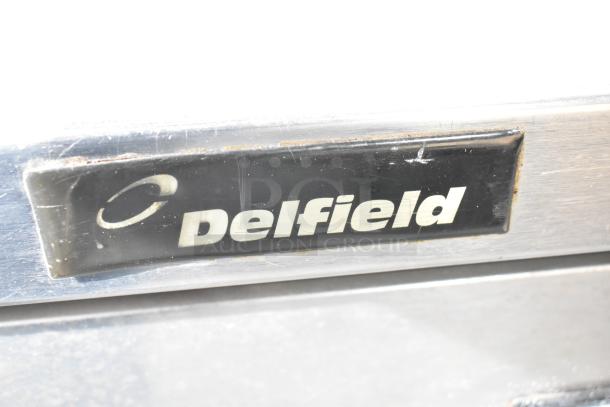 Delfield 18672PTBM-C Commercial Pizza Prep Table, visible Delfield logo, stainless steel, durable, 115V, 1 phase.