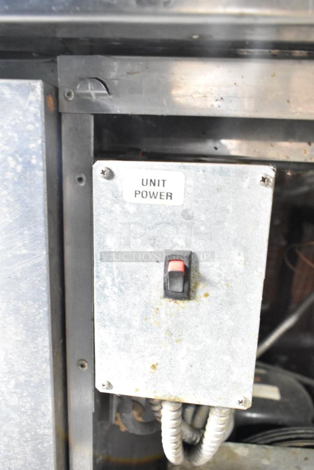 Delfield 18672PTBM-C pizza prep table power unit with switch. Includes 2 drawers, 1 door. 115V, 1 phase. Some wear visible.