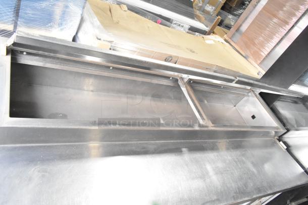 Delfield 18672PTBM-C commercial pizza prep table, 2 drawers, 1 door, stainless steel, 115 volts, shown open.