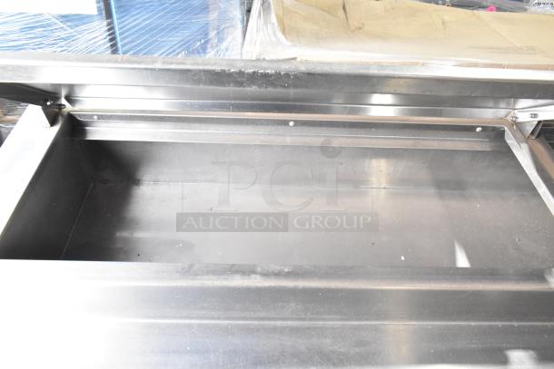 Delfield 18672PTBM-C commercial pizza prep table, stainless steel interior. Features: 2 drawers, 1 door. 115 volts, 1 phase.