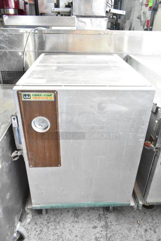 Cres-Cor Crown-X commercial holding cabinet on casters, metal casing, wooden panel with latch, visible brand label.