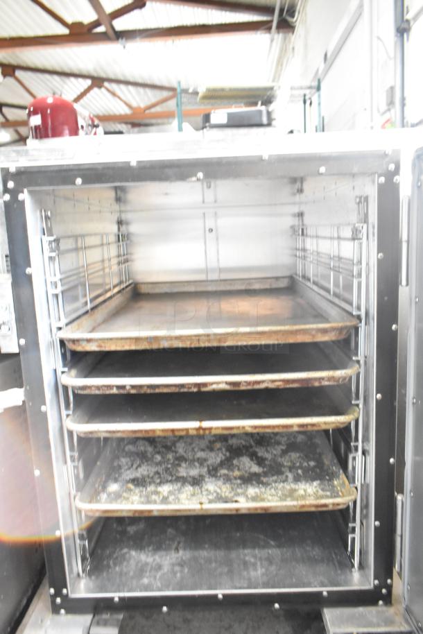 Cres-Cor Crown-X commercial holding cabinet on casters, multiple shelves, stainless steel, used condition with visible wear.