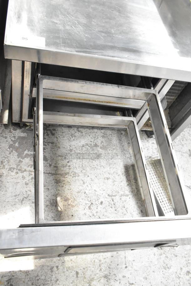 True TRCB-36 commercial 2 drawer chef base on casters. Stainless steel, 115 volts, 1 phase. Visible wear on top surface.