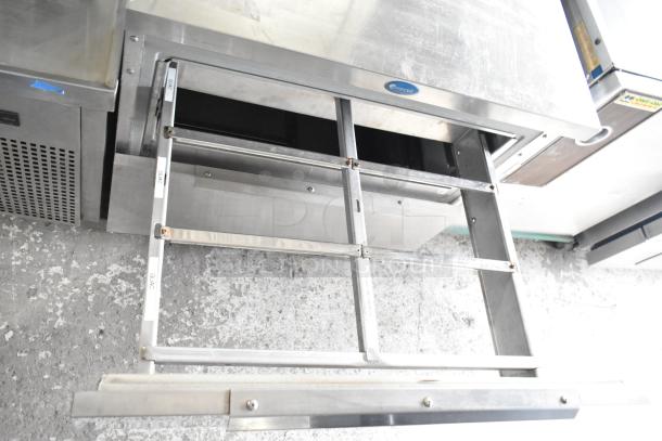 Randell 9404-32D-7 undercounter cooler with open drawers, stainless steel, cut power cord, label indicates "GUAC."