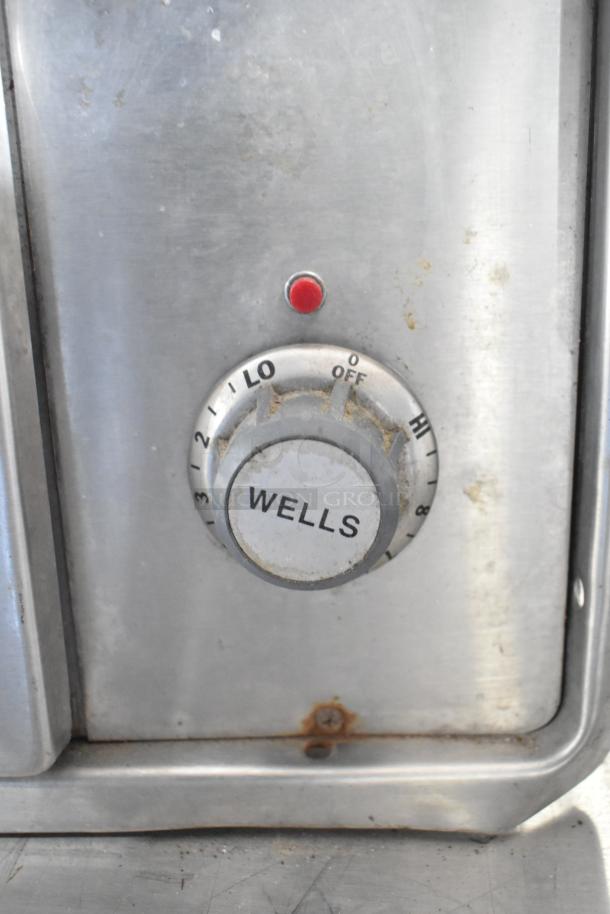 Wells W23HD commercial warming drawer dial; 120V, 1-phase, visible wear, brand label present.