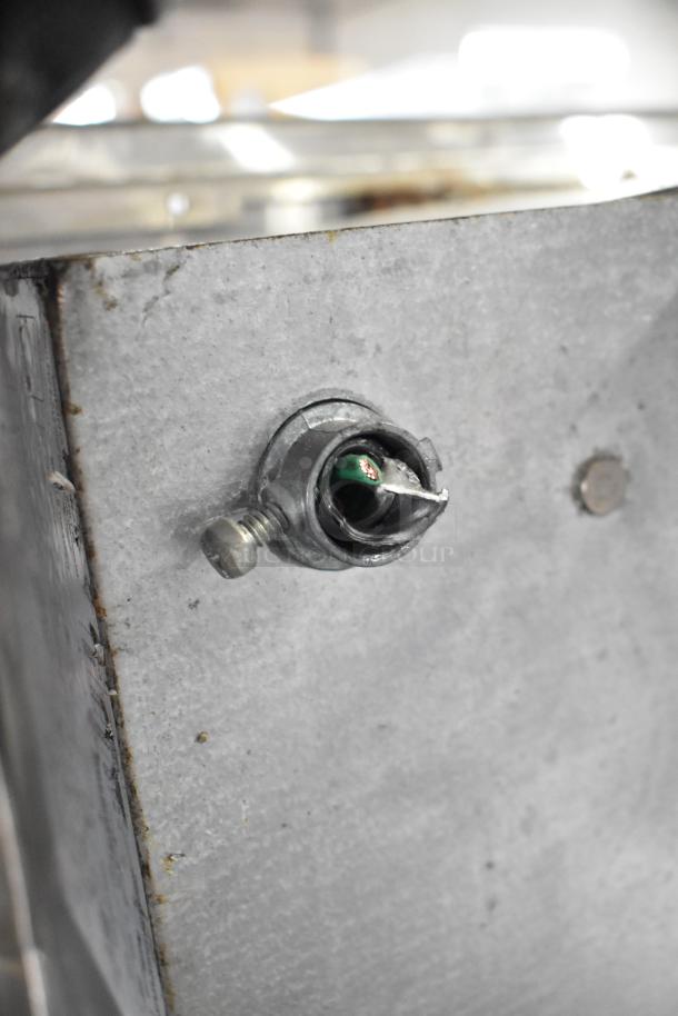 Close-up of a metal component on a Wells W23HD Commercial 2 Drawer Warming Drawer, showing part of its construction details.