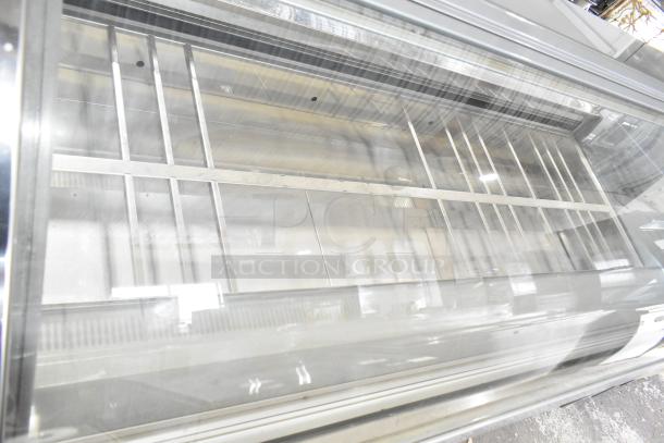 Strike C83F-G12-STL commercial gelato case, floor style, 220V, 1 phase; clear glass display, metal shelves, new condition.