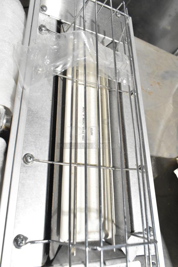 Hatco Commercial Warming Strip, 120 Volts, 1 Phase; metal frame with protective grill, labels with brand and power info visible.