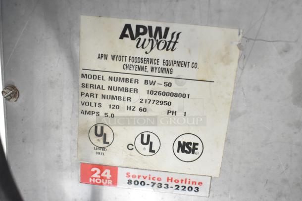 APW Wyott BW-50 warming drawer label. Displays model, serial, part numbers, voltage, UL, and NSF certifications.