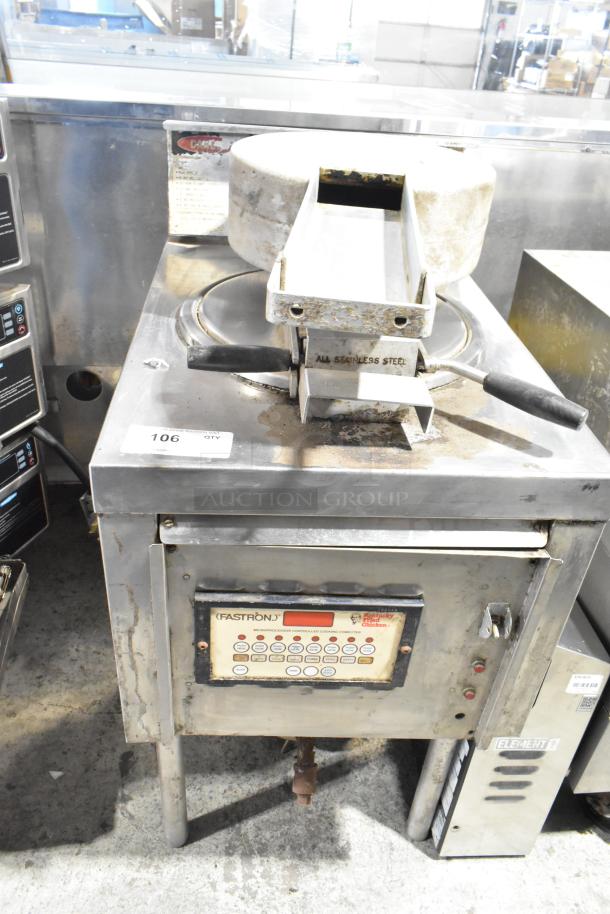 Commercial floor-style pressure fryer, stainless steel, worn condition, visible controls and markings.