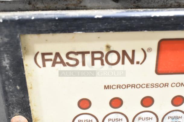 "Fastron microprocessor control panel on commercial pressure fryer, showing push buttons, slight wear visible."