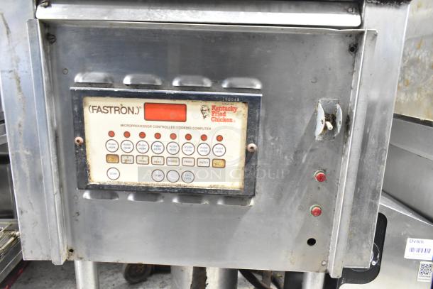 Commercial floor-style pressure fryer with Fastron microprocessor controls, used condition, KFC branding on panel.