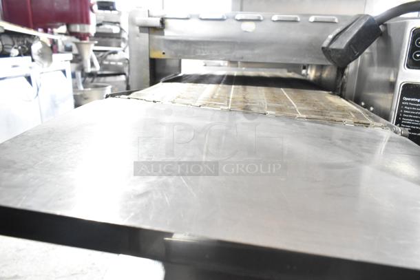 Turbochef HhC2020 commercial conveyor rapid cook oven, electric, 208/240V, 3-phase, stainless steel, good condition.