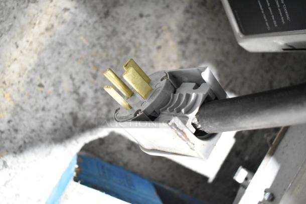 Close-up of a Turbochef HhC2020 oven power plug. Electric-powered, 208/240V, 3-phase connector.